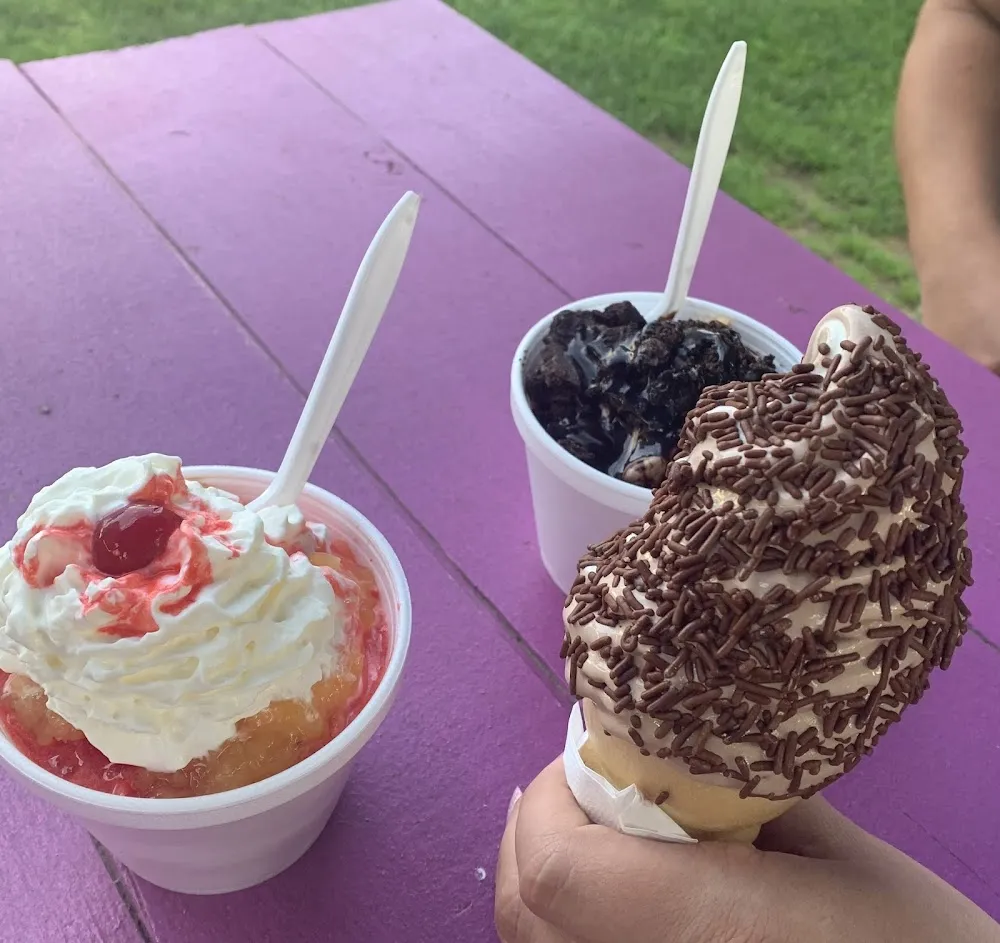Ice Cream Sundae w Pineapple and Crushed Cherries Swirl Cone w Chocolate Sprinkles and a Cho Ice
